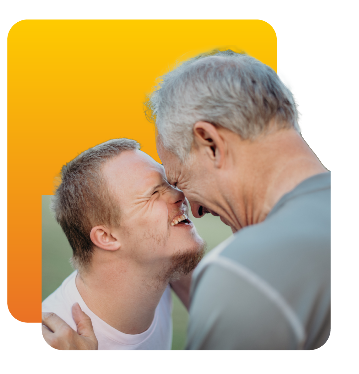 Grandson and grandpa smiling at one another