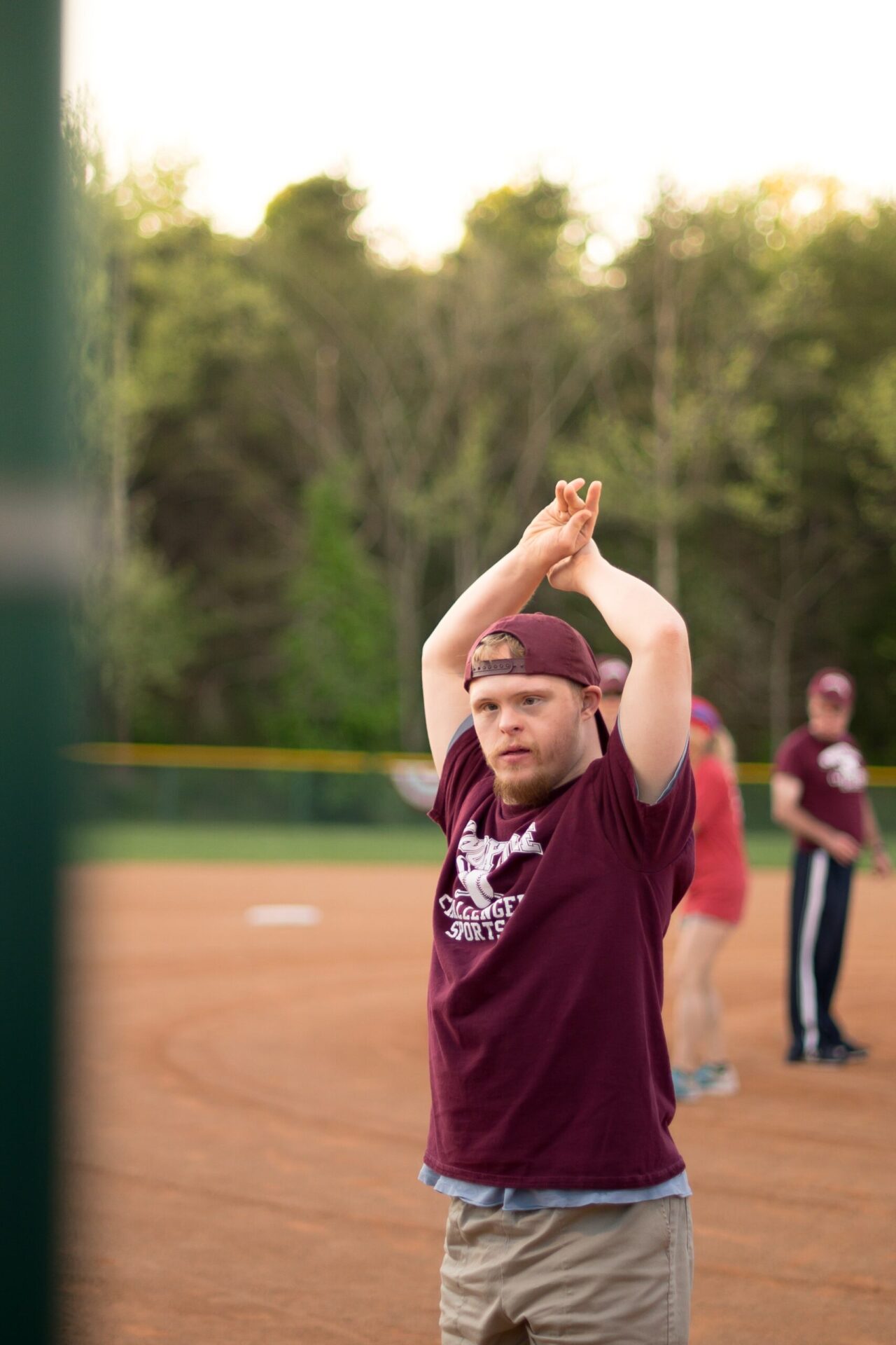 Young adult man with down syndrome playing softball