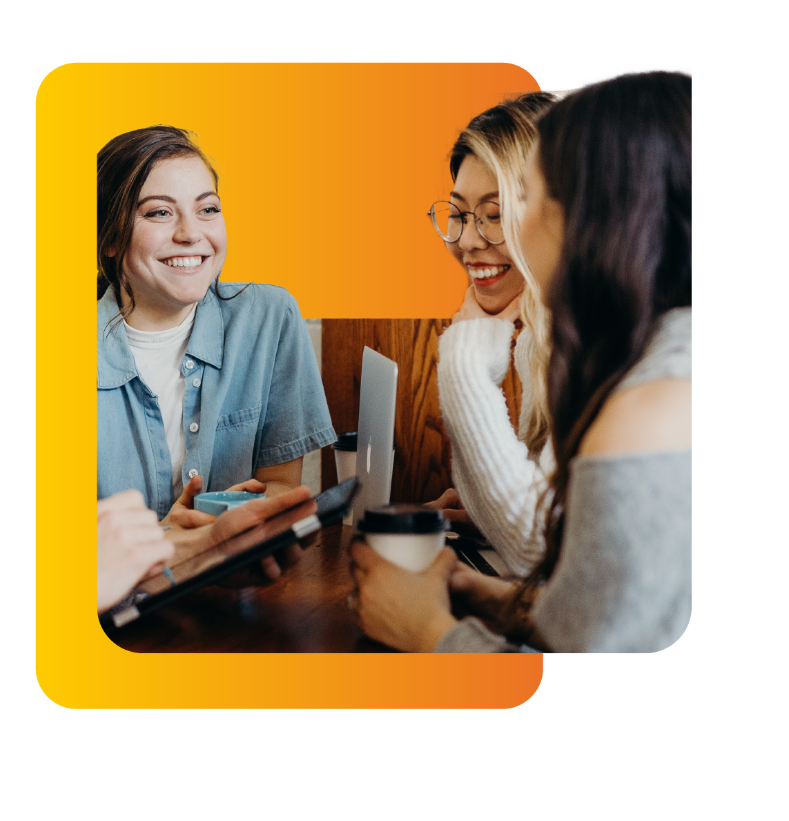 Three young adult woman chatting over coffee